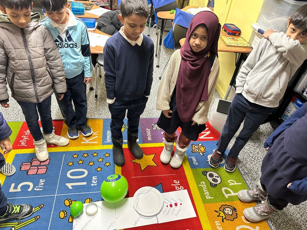 In STEAM class, our 2nd graders learned all about the solar system, our planets, and stars. They made scaled-down versions of each planet to better understand their size comparisons and were mind-blown by the results! 🌍✨ They also learned how any spherical shape is measured using diameters and circumference.